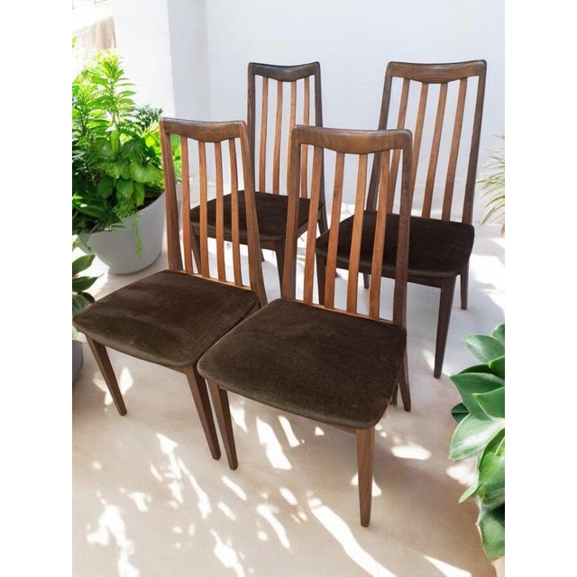 Transform your dining space with this exquisite set of four Mid Century G Plan Fresco vintage dining chairs, consisting of...