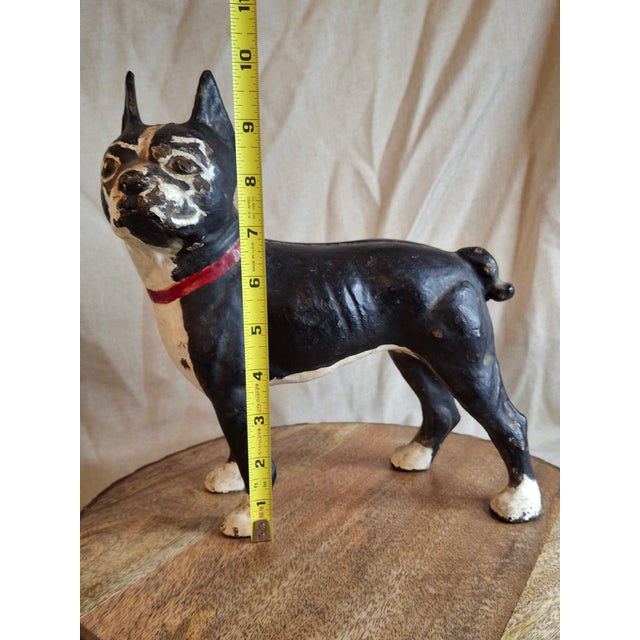 Offering a highly collectible, authentic antique left-facing Boston Terrier cast iron doorstop, manufactured by the...