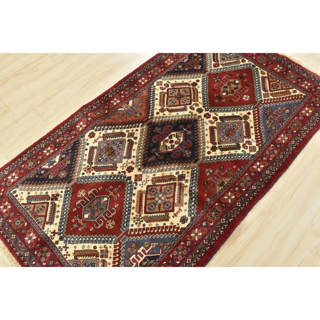 An authentic vintage tribal Yalameh rug hand-knotted with fine wool and natural dyes. This finely woven nomadic rug...