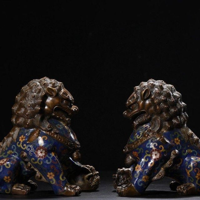 This is a striking pair of vintage cloisonné enamel guardian lions, also known as Foo Dogs or scholar's desk lions. Each...