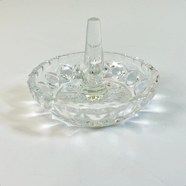 A pretty cut crystal Ring Holder. We all need one of these to catch our rings. This one has a starburst cut design with a...