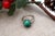 White gold ring with brilliant-cut diamonds (16) and cabochon-cut malachite. Metal: Gold. Origin: Portuguese. Brand:...