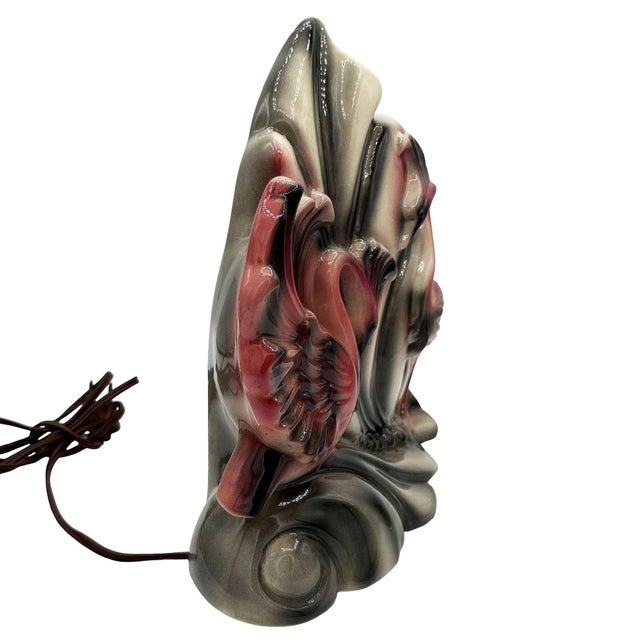 Mid-century pink and white ceramic California pottery Sawn TV accent lamp. The table lamp features a beautifully detailed...