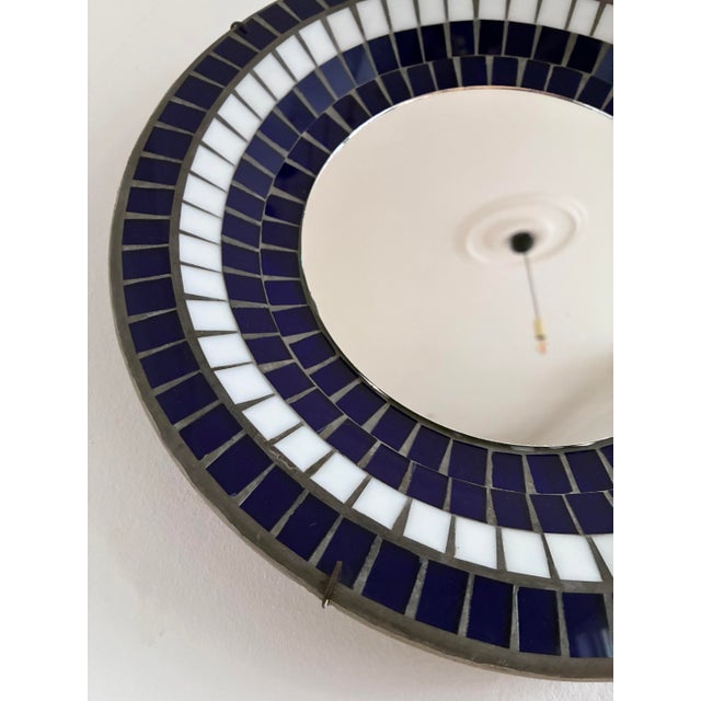 Round mosaic wall mirror, marked B. J. H. Moller and Diana-KUNST. This decorative mirror features a central round mirror...