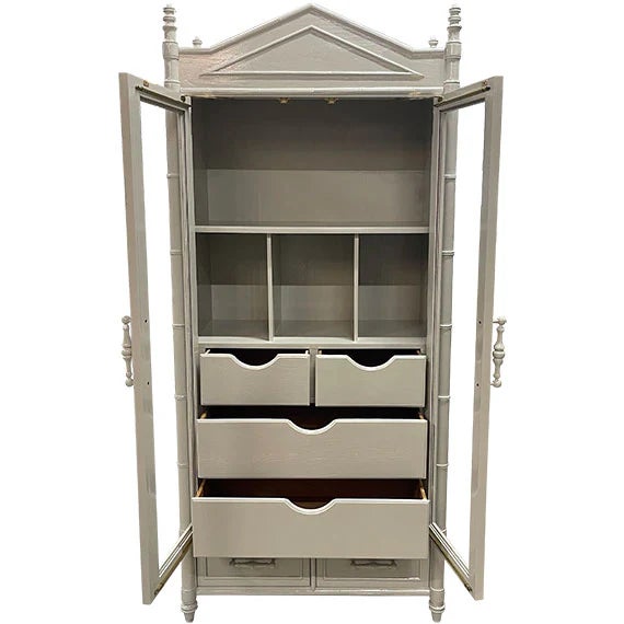 A tall painted display cabinet in a soft gray finish with glass-paneled double doors and two lower drawers.