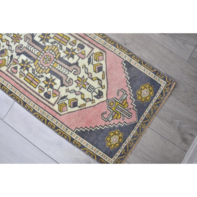 This is a vintage Turkish Oushak rug from the 1960s. The piece was hand-knotted.