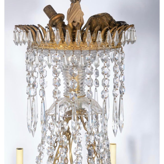 Rare and very fine Early 19th Century Anglo-Irish English Regency Period Chandelier. Gilt bronze ring features decorative...