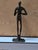 A vintage museum quality bronze sculpture of a musician in the style of giacometti. Having artistic highly stylized and...