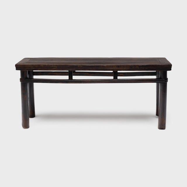 This antique Chinese bench was a versatile seat in the Qing-dynasty (1644-1911) home, whether placed beside the table for...
