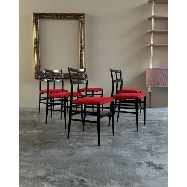 A set of six "Superleggera" chairs designed by Gio Ponti for Cassina, dating back to the early 1960s. The chairs have a...
