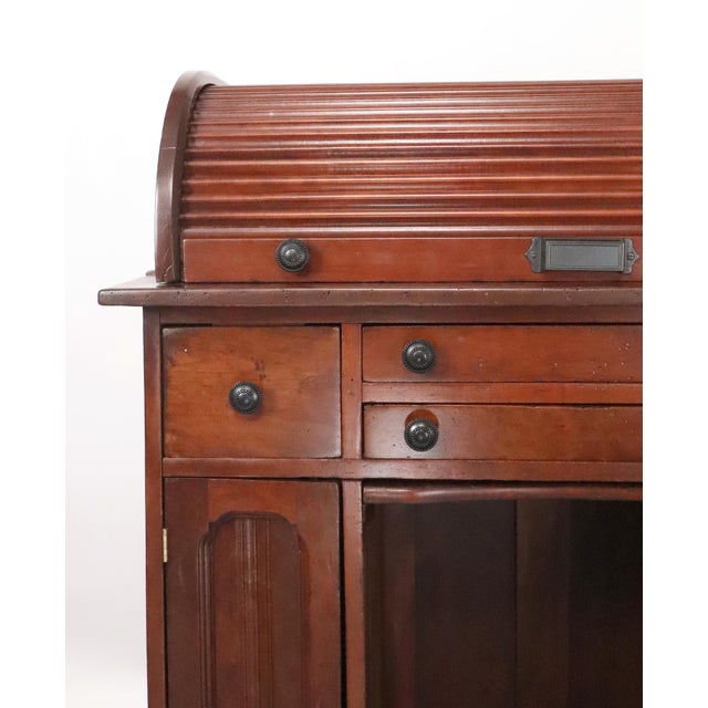 Antique watchmaker's or jeweler's workbench made of dark finish wood with casters. This bench was designed for precision...