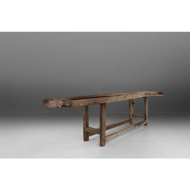 Large workbench with wooden top. Has a great patina that is created over the years. This workbench can be used as console...