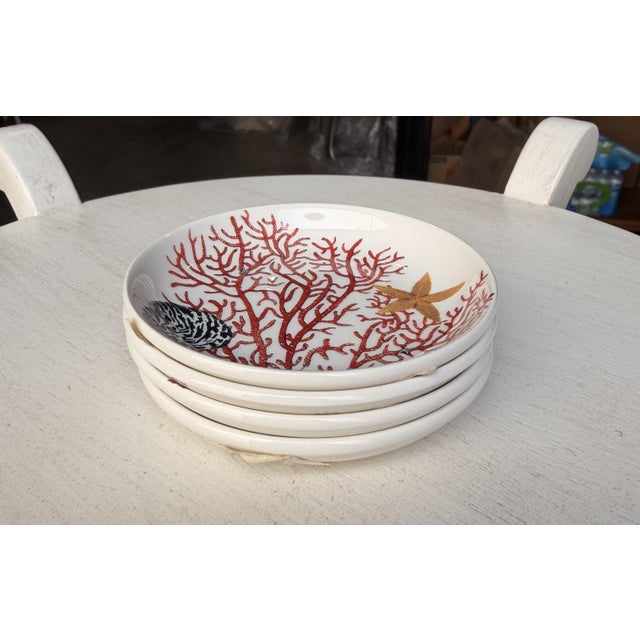 Bring timeless coastal charm to your décor with this elegant Gien France decorative plate from the Ocean Collection....