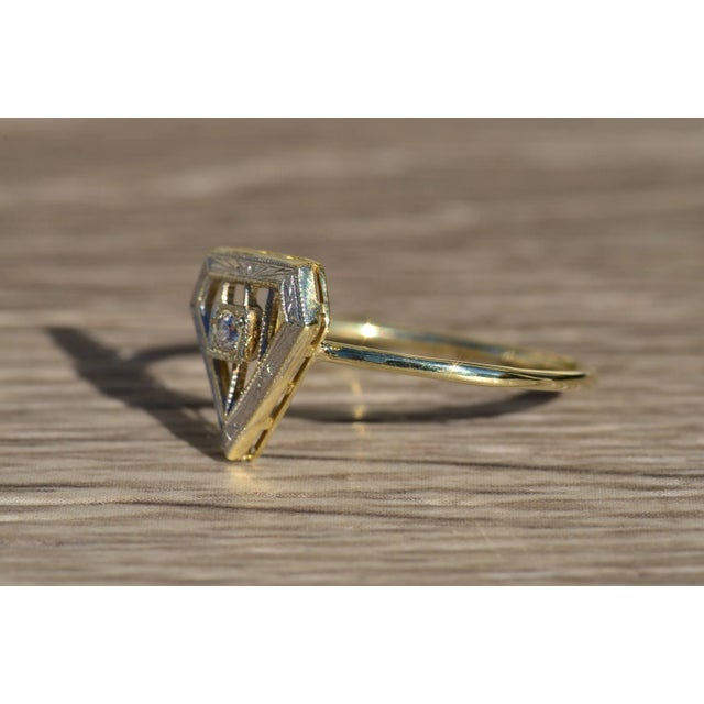 The Arlo Antique platinum topped 14 K Yellow Gold Shield Ring Set with Diamond. This slender ring is crafted in 14 karat...