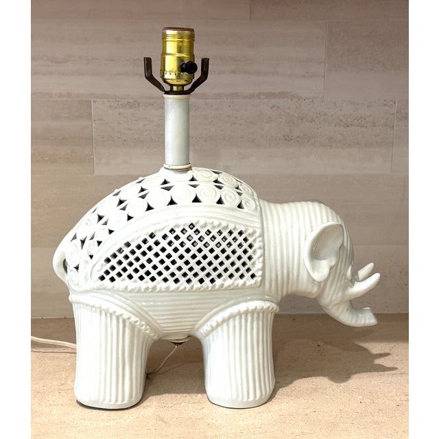 Ceramic white lamp in the form of an elephant. Blanc de chine with pierced lacy detailing. Made in the 1960's by Morris...