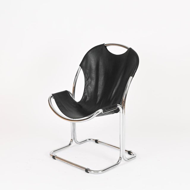 Elegant Bauhaus-style cantilever chair in chrome-plated metal and black leatherette. This stylish chair is attributed to...