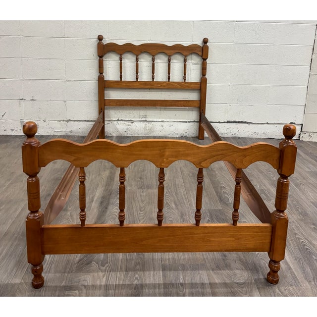 This is a stunning vintage twin sized maple wood cannonball spindle bed. Features beautiful cannonball finials and ornate...