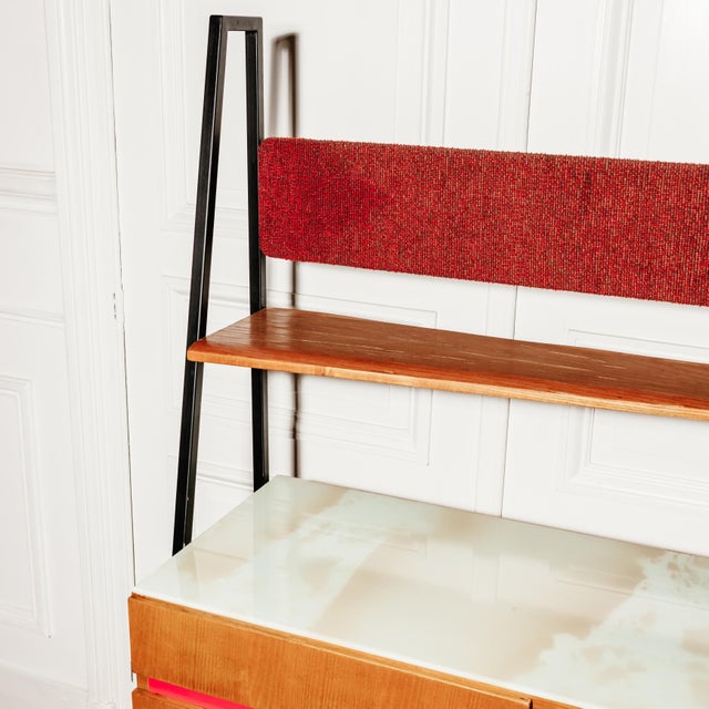 Vintage highboard comprising a sideboard with three doors and four drawers, and a long shelf whose back panel is covered...