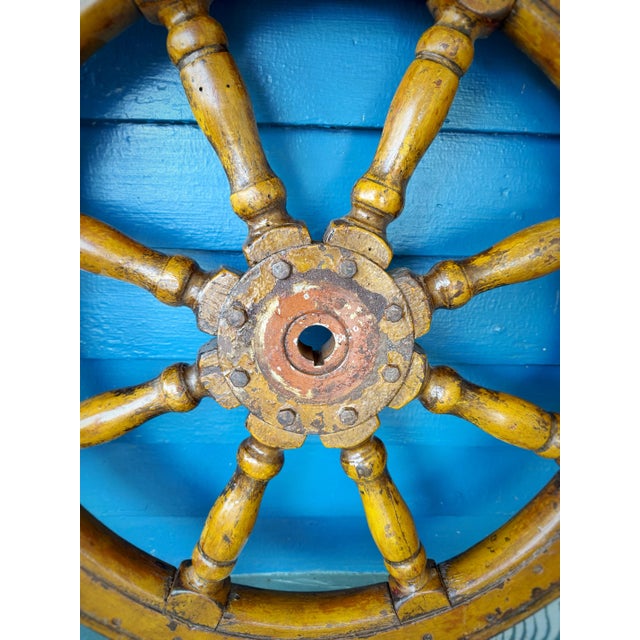 Substantial vintage wooden ship’s wheel measuring an impressive 38.5 inches in diameter, featuring eight turned spokes...