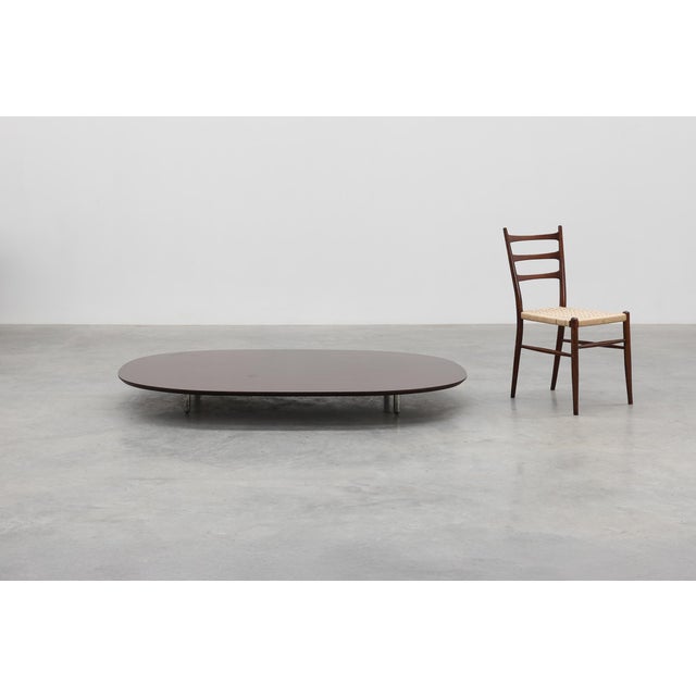 A sleek mid‑century design by Cappellini, this Italian coffee table embodies minimalist sophistication. The large, low...