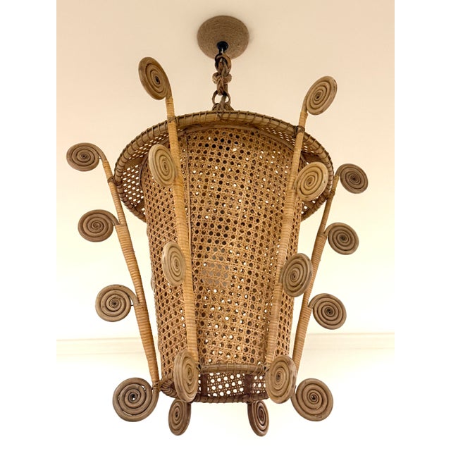 Large rattan and caned sides lantern. Pagoda style top. Four arms with curled rattan design. This has been professionally...