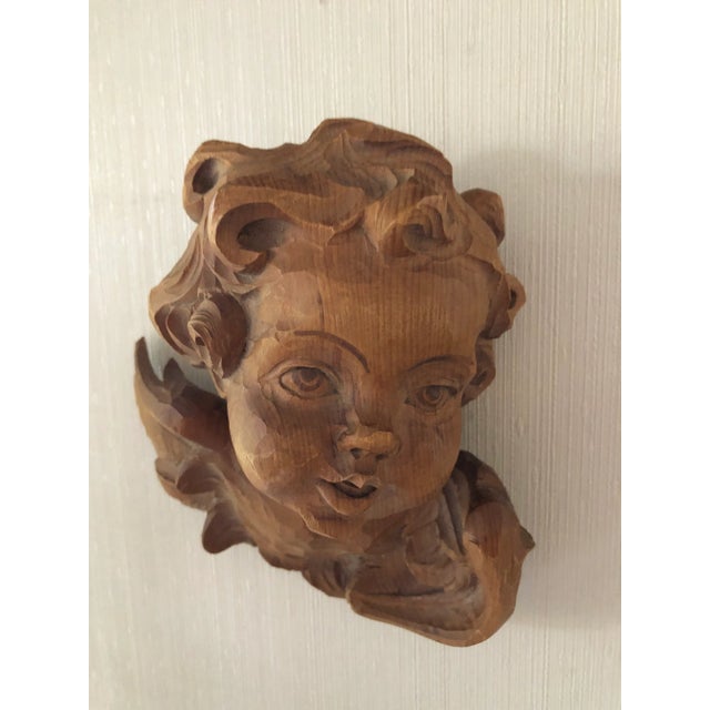 Beautifully carved by hand , wood face of a cherub. Circa 1960’s Made in Italy Measures 8.5” h x 8” w x 4” d. Excellent...