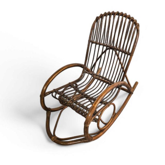 Rohé Noordwolde bent wicker / rattan rocking chair This piece is attributed to the mentioned designer/maker. It has no...