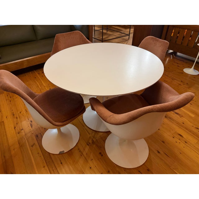 Mid-century modern Circa 1960s Knoll Associates Eero Saarinen dining set with a white laminate top and four matching...