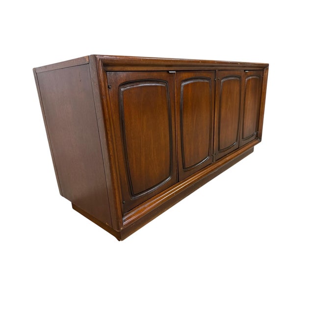 Bring timeless sophistication to your home with this Mid-Century Modern Broyhill Emphasis walnut storage cabinet, crafted...