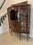 Outstanding quality antique Victorian mahogany inlaid serpentine shape display cabinet having a low mahogany satinwood...