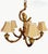 A fun and whimsical faux bamboo 5 light chandelier with a large parrot center. The chandelier features a faux bamboo body...