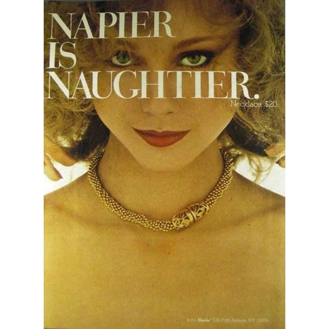 1979 goldtone multi-strand ball chains with openwork foliate snap clasp torsade necklace. Marked "NAPIER©" inside the...