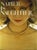 1979 goldtone multi-strand ball chains with openwork foliate snap clasp torsade necklace. Marked "NAPIER©" inside the...