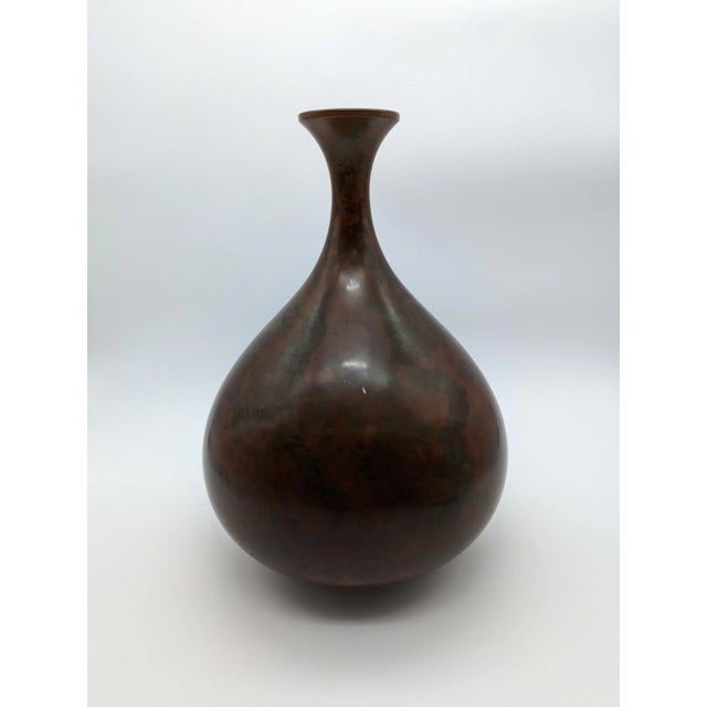 Delicately shaped Murashido vase with a bulbous base, thin neck, and small opening. Incredible red/green patina from the...