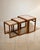 A beautiful set of three 1970s Scandinavian nesting tables featuring solid teak frames and tiled tops. Each table nests...