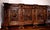 Solid walnut sideboard, completely carved and engraved with bas-reliefs and grotesque figures, making this piece of...
