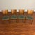 Set of four vintage Danish solid teak dining chairs, a wonderful combination of form and function. Frames are sturdy yet...