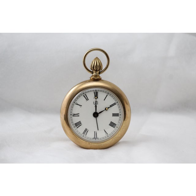 Gold pocket watch shape alarm desk clock Mechanical table clock Brass, glass. France, 1960s. Working condition....