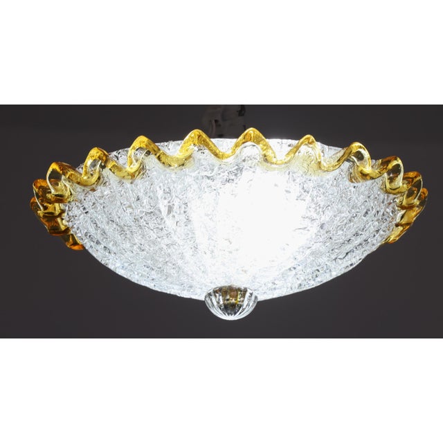 Extraordinary yellow\orange color and transparent/silver Murano ceiling light. The ceiling light consists of two glass...