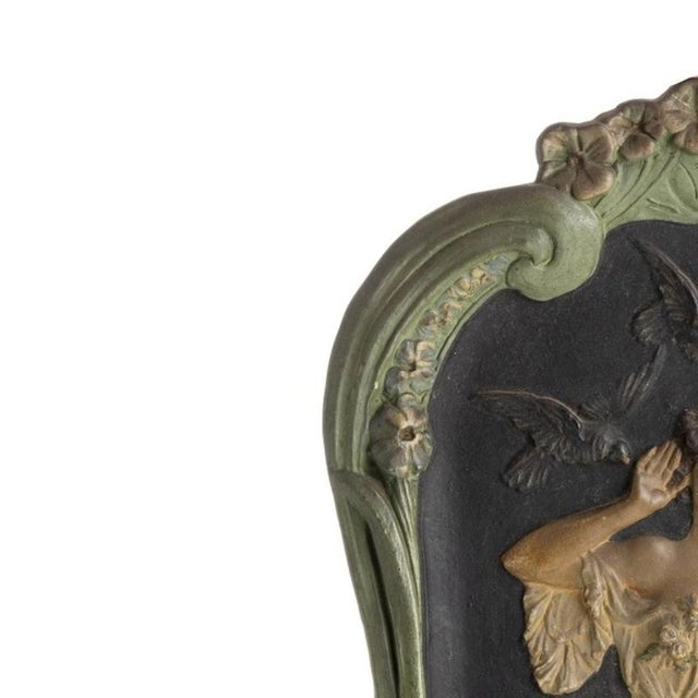Porcelain - Art Nouveau wall plaque. "Female Figure", European, circa 1900 in polychrome terracotta, embossed and gilded....