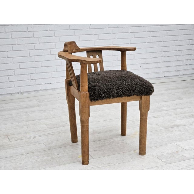 1950s, Danish design. Reupholstered armchair in quality New Zealand sheepskin Wellington. Renewed oak wood. Manufactured...