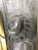 A pair of French Art Deco wall sconces by French artist Genet et Michon in clear frosted glass shades with floral motif...