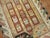 A whimiscal Turkish Scatter size rug from the 1st quarter of the 20th Century Measures: 4'3'' x 5'6''.