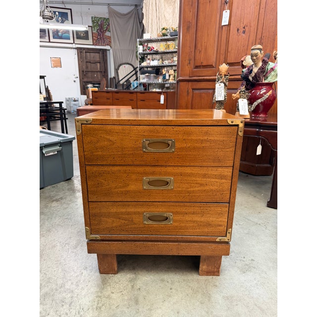 A handsome and exceptionally sturdy vintage Mid-Century Modern 3-drawer campaign-style nightstand, bachelors chest, or end...
