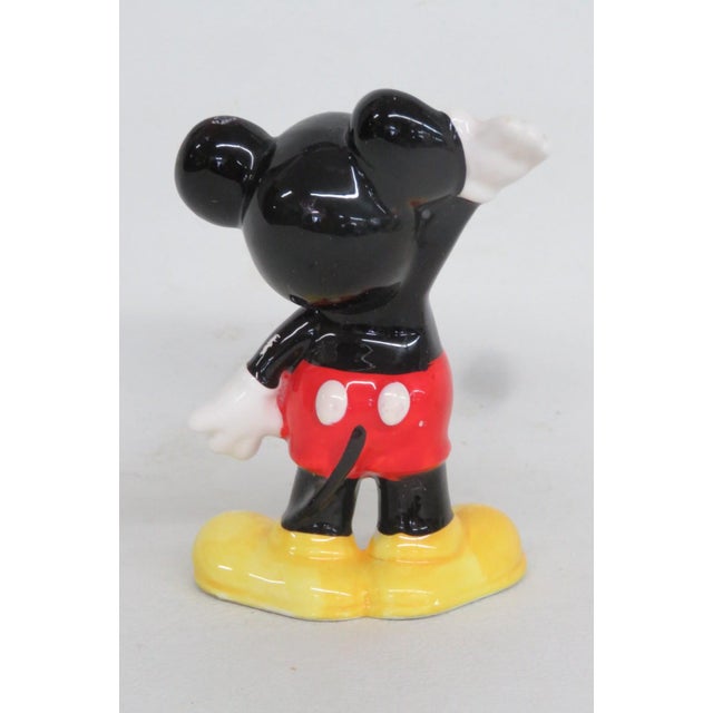 This adorable Mickey Mouse Figurine is made out of ceramic. This lovely little figure was made by Walt Disney Productions...