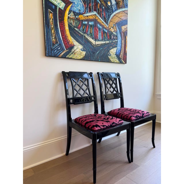 This striking set of four vintage Chinoiserie dining chairs features newly upholstered removable seats in iconic...