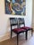 This striking set of four vintage Chinoiserie dining chairs features newly upholstered removable seats in iconic...