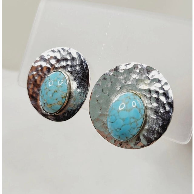 These eye catching 1950s Les Bernard Turquoise and Hammered Silver Earrings will be a fabulous addition to any vintage...