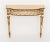 An elegant Italian Neoclassical style painted console table featuring a gracefully bowed front accented with a striking...