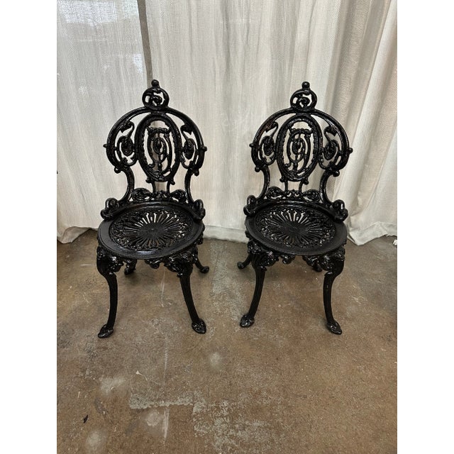 Beautiful English traditional design antique iron chairs. Made in USA.